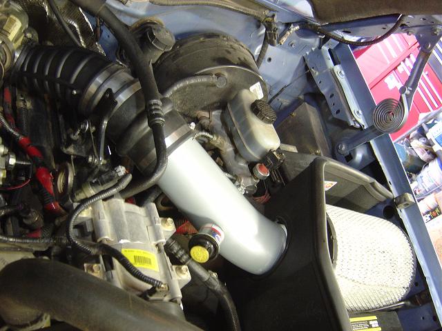 Engine bay showing air intake system and engine components