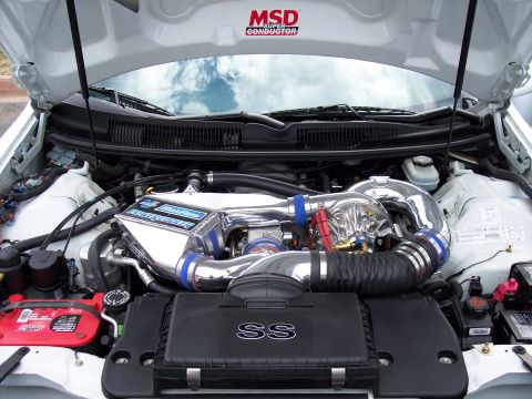 1972 Ford Ranchero - Aftermarket turbocharger and intercooler installed in a vehicle's engine bay.