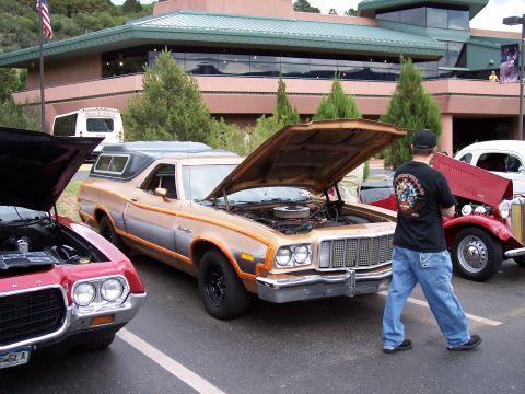 1972 Ford Ranchero - A 1972 Ford Ranchero is displayed with its hood open, its engine bay at a car show.