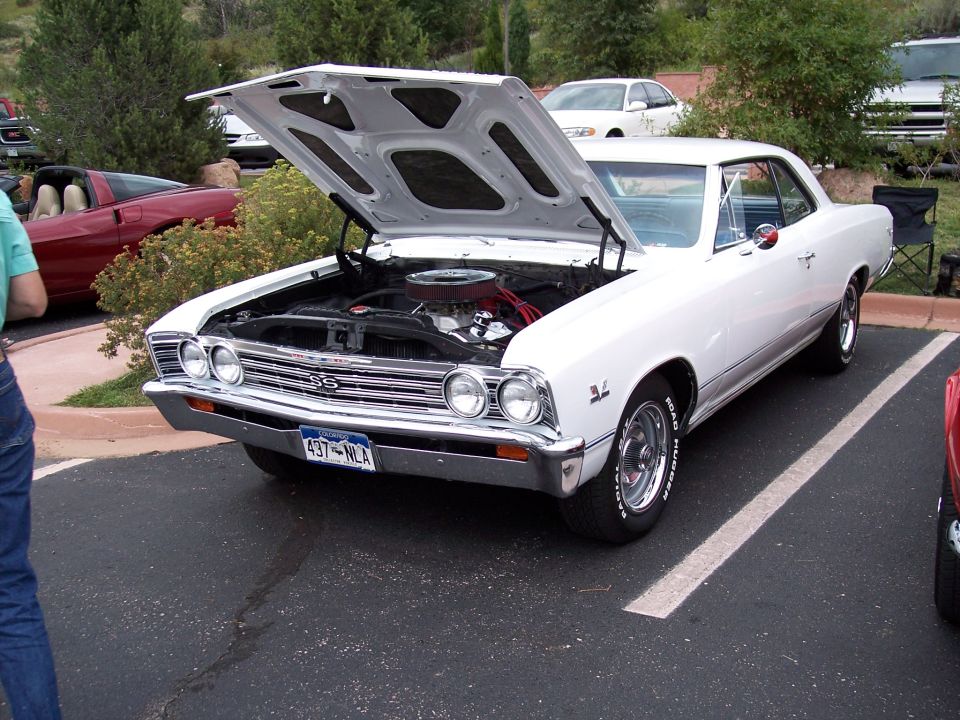 White 1967 Chevrolet Chevelle SS coupe, hood open, showing engine. License plate 437-NLA