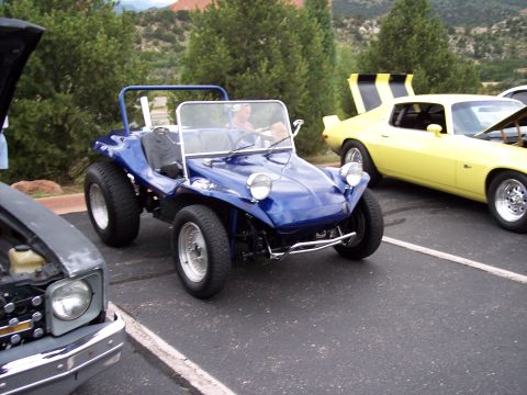 1972 Ford Ranchero - A blue dune buggy is parked at an outdoor event, with other vehicles visible in the background.