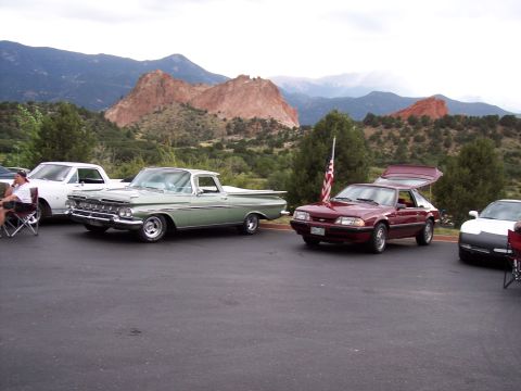 1972 Ford Ranchero - A light green 1959 Chevrolet El Camino is parked at an outdoor event with a scenic mountain backdrop.