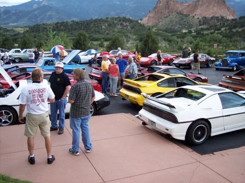 1972 Ford Ranchero - A car show features several Pontiac Fieros with a scenic mountain backdrop.