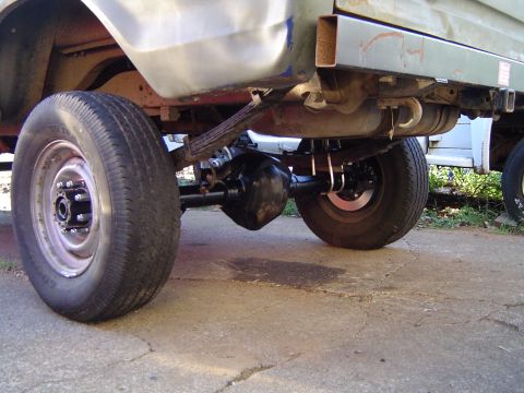 1978 Ford Bronco - Close-up view of the rear suspension and axle of a vehicle.