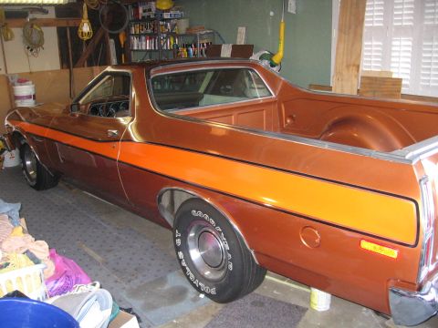 1975 Ford Ranchero - Side view of a 1975 Ford Ranchero pickup truck with an orange stripe.
