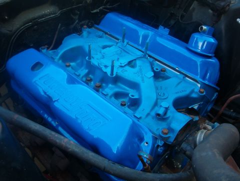 1968 Ford Ranchero - Close-up of a blue Ford engine, "Ford" embossed on the valve covers.