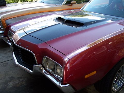 1972 Ford Ranchero - Front view of a red 1972 Ford Ranchero, with another Ranchero parked behind it.