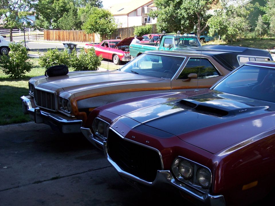Maroon 1972 Ford Ranchero front end with black hood stripe