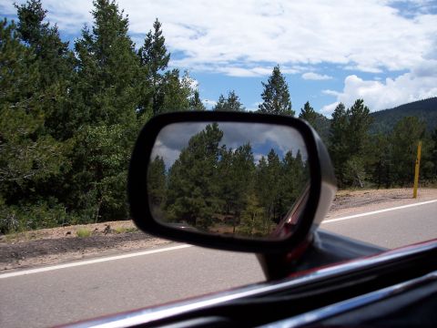 1972 Ford Ranchero - View from inside a car, looking out the side window and into the side view mirror.