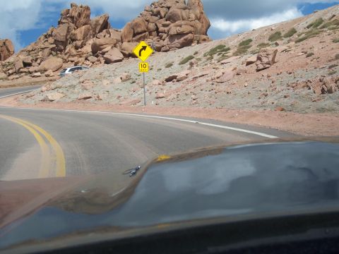 1972 Ford Ranchero - A 1972 Ford Ranchero drives on a mountain road, with a speed limit sign visible.