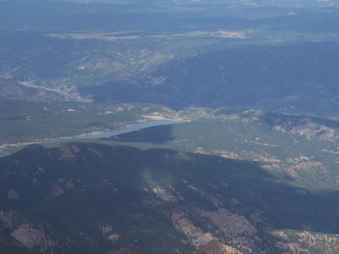 1972 Ford Ranchero - View from a high vantage point overlooking a vast mountain range, a lake, and a road.