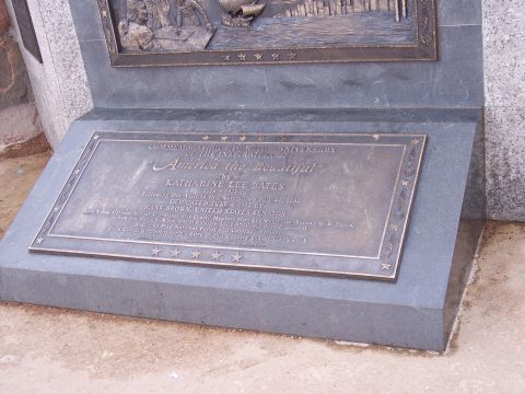 1972 Ford Ranchero - A bronze plaque on a stone monument details the commemoration of "America the Beautiful" and its dedication date.