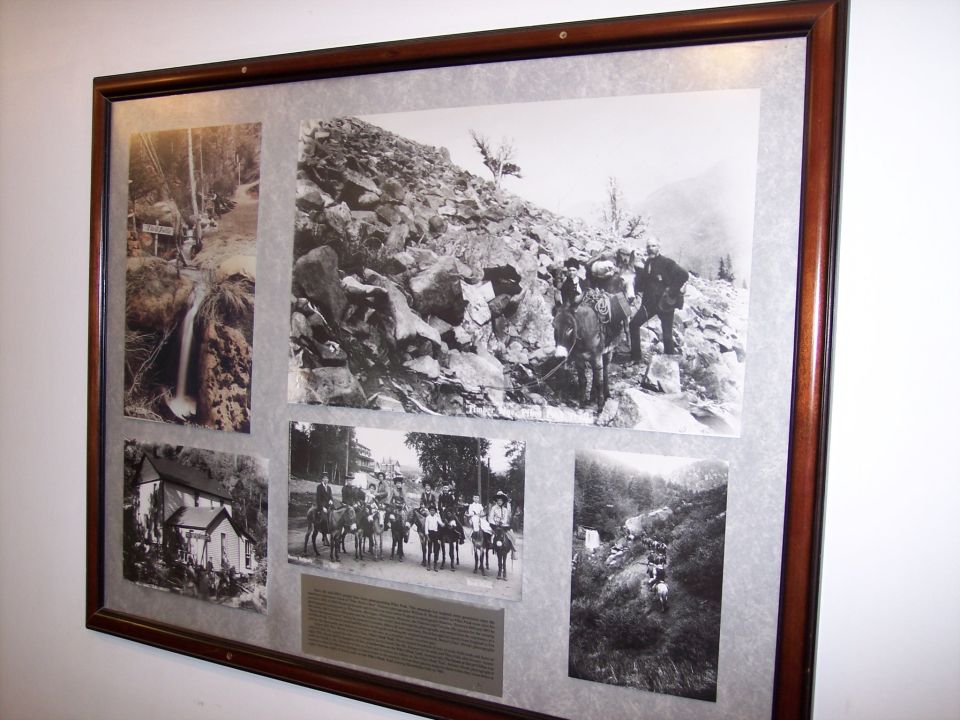 Framed collage of five black and white historical photographs depicting a waterfall, a rocky mountainside with people and pack animals, a group of people on horseback, a building, and a mountainous landscape with a road