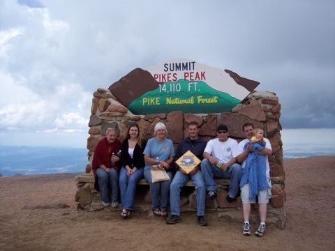 1972 Ford Ranchero - A family poses for a photo at the summit of Pikes Peak, a popular tourist destination.