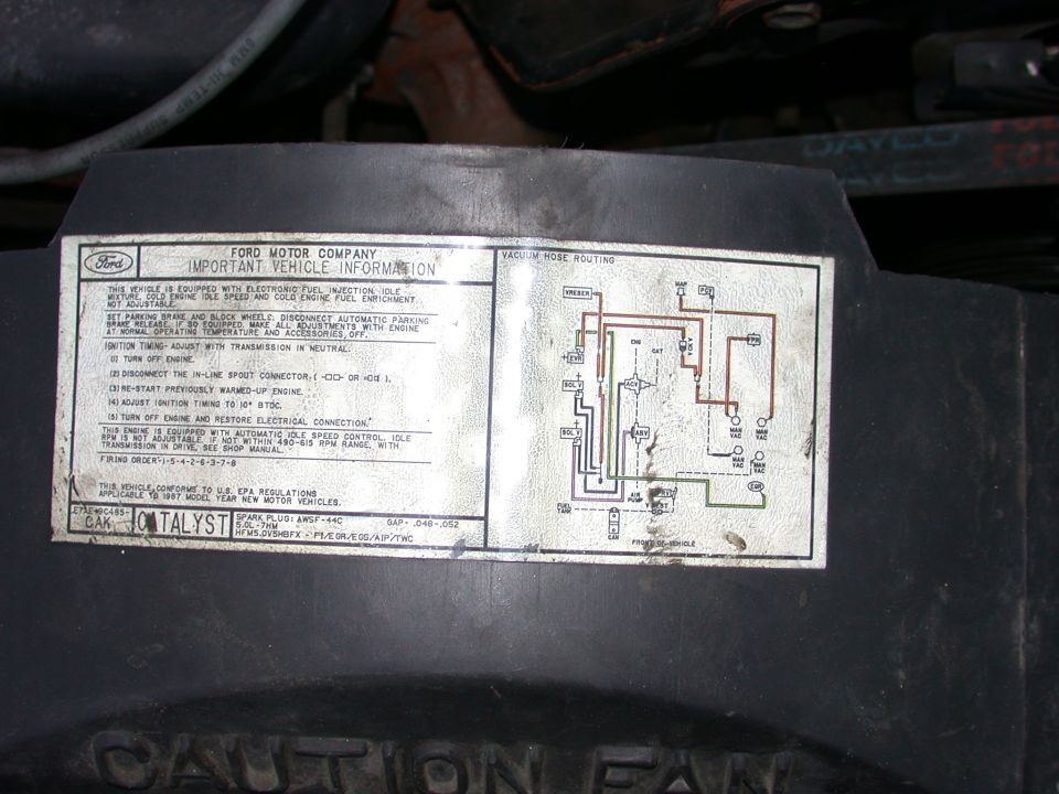 1987 Ford 5.0L EFI vehicle information decal with vacuum hose routing diagram on fan shroud