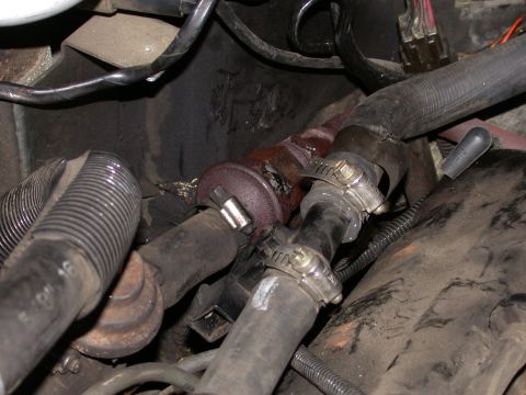 1987 Lincoln Town Car - Close-up view of an engine vacuum hose assembly, showing hoses, clamps, and associated wiring.