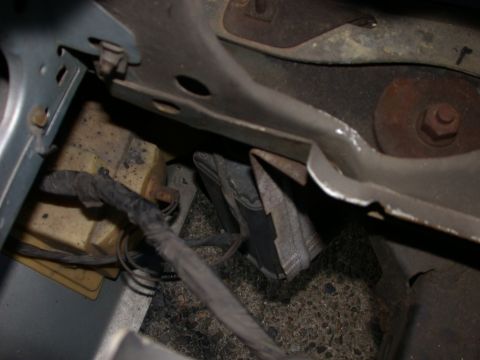 1987 Lincoln Town Car - Close-up view of engine compartment components, including wiring and metal structures.