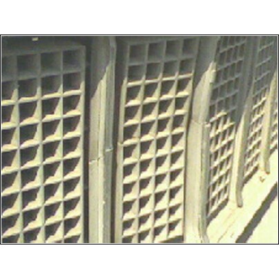 1973 Ford Ranchero - The intricate square pattern of the vehicle's grille is visible in this close-up shot.