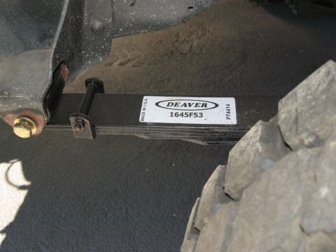 1986 Ford Bronco - A close-up shows a DEAVER leaf spring, indicating a part number and manufacturing origin.