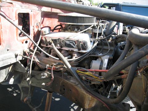 1986 Ford Bronco - Close-up view of an engine compartment, showing various mechanical components and wiring.