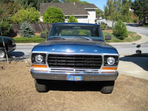1978 Ford Bronco - Front view of a blue 1978 Ford Bronco parked outdoors.