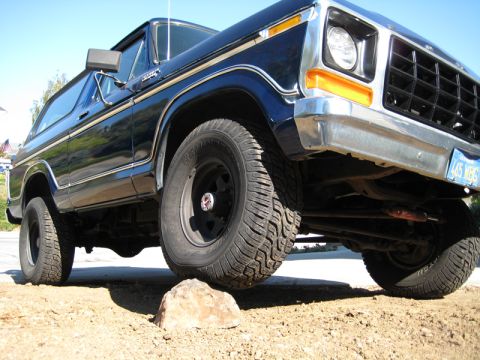1978 Ford Bronco front quarter view, tire on a rock