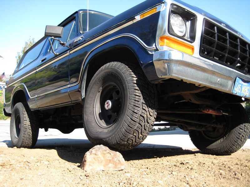 1978 Ford Bronco front quarter view, tire on a rock
