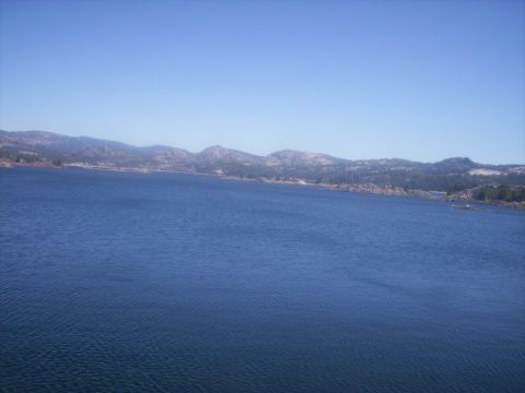 1989 Ford Bronco - A scenic view of a large body of water with distant hills and mountains.