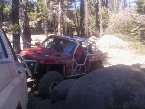 1989 Ford Bronco - Modified off-road buggy navigating rocky terrain with another vehicle nearby.