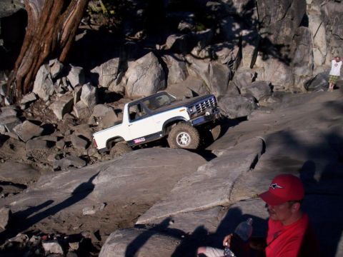 1989 Ford Bronco - This SUV navigates a challenging rocky trail, its off-road capabilities.