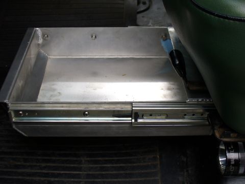 1978 Ford Bronco - An aluminum slide-out storage drawer is visible next to a green seat, likely an aftermarket addition.