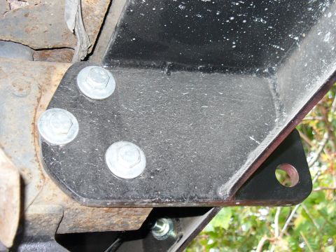 1978 Ford Bronco - This image shows a close-up of a vehicle's frame and a bolted-on metal bracket, not a rear bumper.