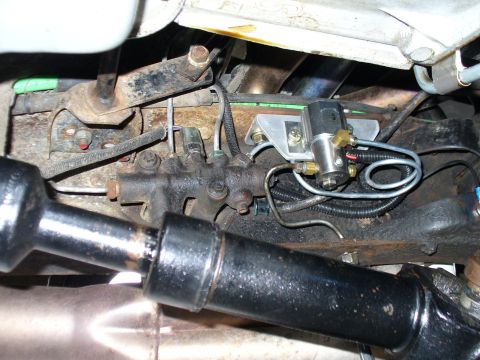 1978 Ford Bronco - Underside view of a vehicle's brake system components and driveshaft.