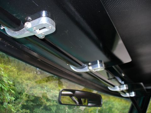 1978 Ford Bronco - Custom visor mounts are visible inside the vehicle, attached to the black headliner above the windshield.