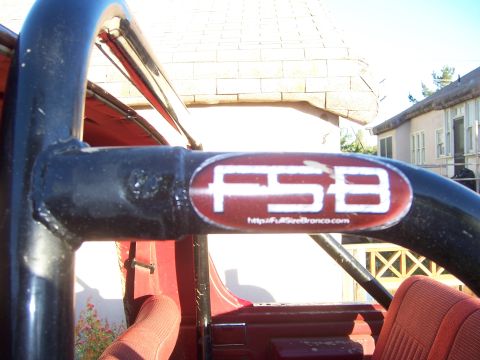 1991 Ford Bronco - Close-up of a roll bar with an FSB sticker and website address visible.