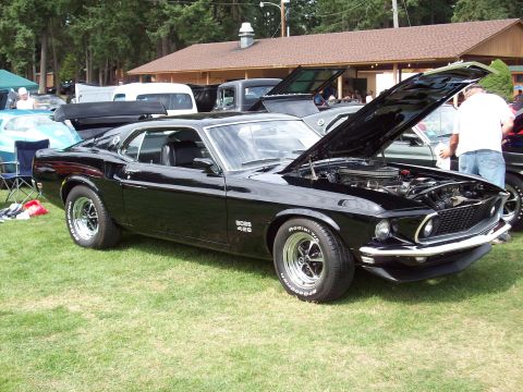 1997 Ford Mustang - This black 1969 Ford Mustang Boss 429 is displayed with its hood open at a car show.