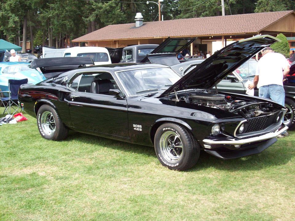 Black 1969 Ford Mustang Boss 429 with hood open