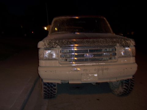 1991 Ford Bronco - This truck appears to be a Ford F-Series from the early 1990s, covered in mud after an off-road excursion.