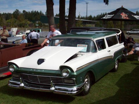 1997 Ford Mustang - Two-tone green and white 1957 Ford station wagon displayed at an outdoor car show.