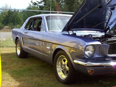 1997 Ford Mustang - This classic Mustang coupe features a 351 badge on the fender and its hood is open.