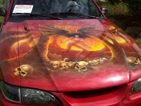 1997 Ford Mustang - Custom airbrushed hood features a demonic scene with a winged figure and numerous skulls.