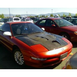 1994 Ford Probe - A red coupe with a custom hood is parked in a lot with other vehicles.