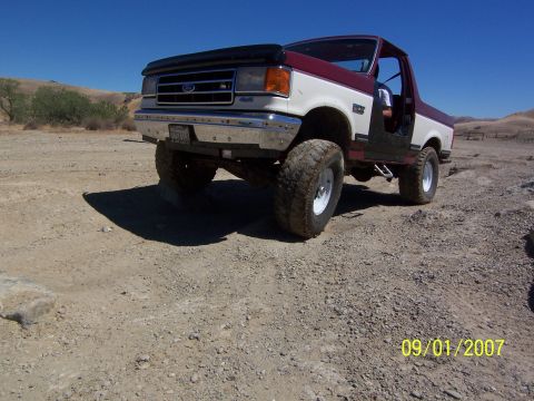 1991 Ford Bronco - A two-tone Ford Bronco is seen off-road on a sunny day, with a date stamp of 09/01/2007.