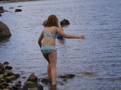 1986 Ford Bronco - Children enjoy a day at the lake, standing in the water near the shore.