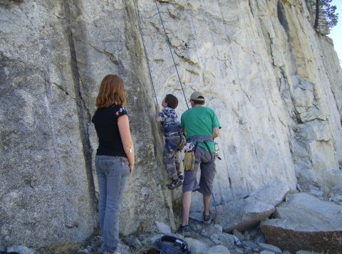1986 Ford Bronco - A family enjoys a day of rock climbing in a natural outdoor setting.