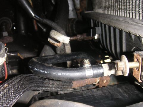 1996 Ford Crown Victoria - Transmission cooler line repair using a hose clamp and a bolt.