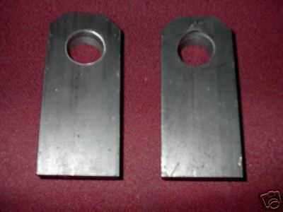1991 Ford Bronco - Two metal brackets, likely for fabrication or repair, are shown against a red background.