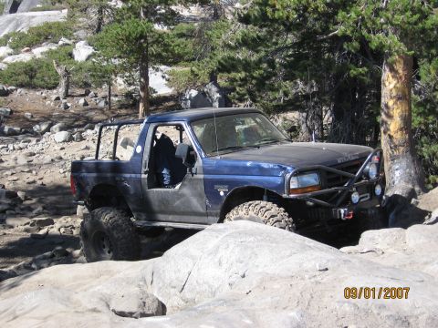 1994 Ford Bronco - This modified Ford Bronco is shown off-roading on a rocky trail.