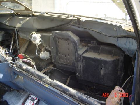 1989 Ford Bronco - The interior of a vehicle shows exposed wiring and HVAC components, with a date stamp visible.