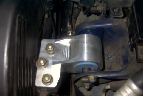 1994 Dodge Stealth - Close-up view of an aftermarket aluminum motor mount with a blue bushing, likely for a performance application.